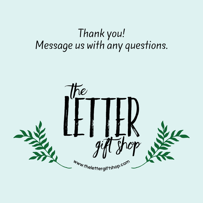 The image is a graphic design for a gift shop called "The Letter gift shop". It features a stylized text "The Letter" in a decorative font, surrounded by green leaves. The text also includes a message that says "Thank you! Message us with any questions." The website "www.thelettered GIFTSHOP.com" is also displayed. The image is a simple, clean design with minimal text and decorative elements.